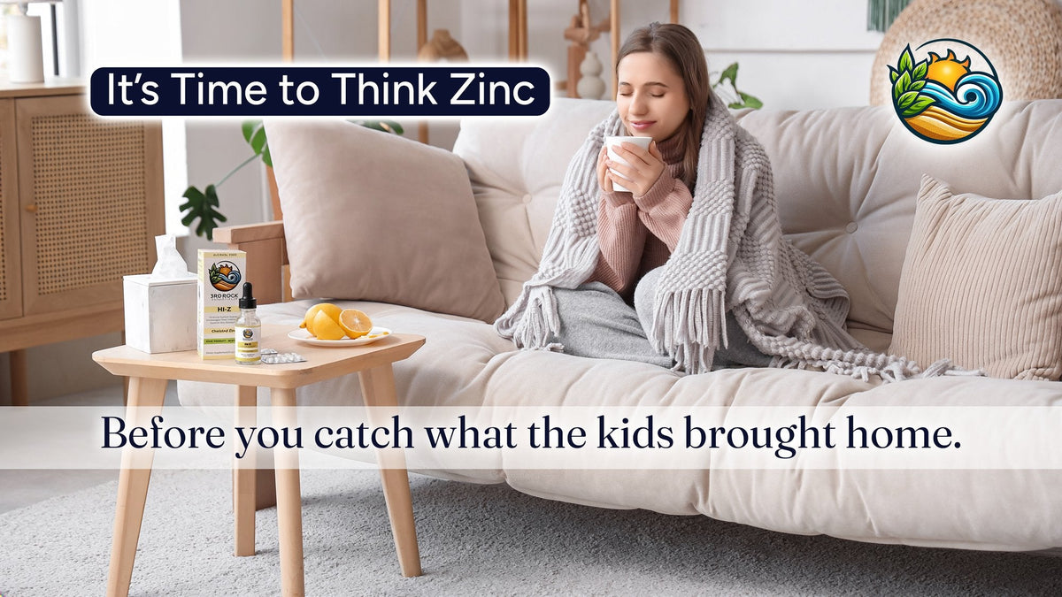 It's time to think zinc: a woman with tea on the couch next to HI-Z liquid zinc